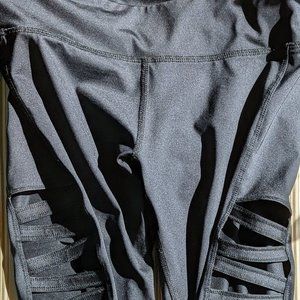 EUC Without Walls black leggings. Stretchy, material, criss cross design on legs